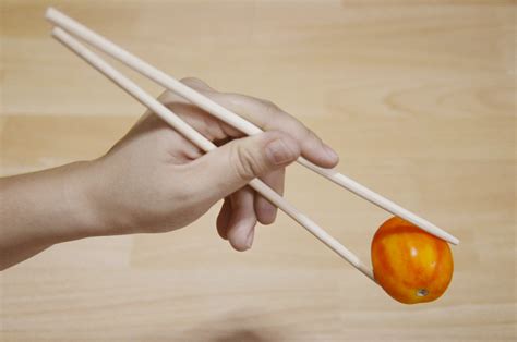 May 4, 2022 · Step 3: Angle the chopstick at about 45º. You should still have a firm grip. Step 4: Lift your index finger and add the second chopstick in place, parallel to the other. Step 5: Adjust the position of your thumb as needed so you are squeezing the top chopstick with your thumb and the underside of your index finger. 